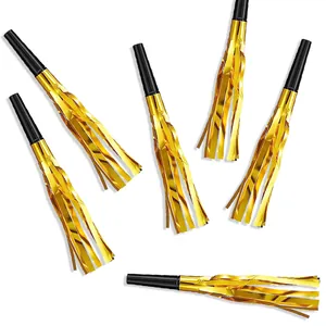 Detail of six gold foil fringe party blowouts with black plastic mouthpieces for New Year