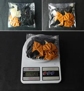 Detail showing 14pcs black and orange balloon set weight of 45.8g and packaging size