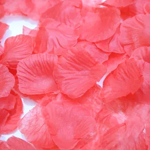 Macro detail of red artificial rose petals showing mesh fabric texture for weddings