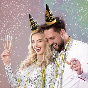 Black and gold Happy New Year party hats with glitter trim and festive lettering