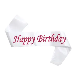 Detailed view of white satin birthday sash featuring red cursive Happy Birthday text