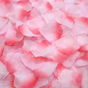 Macro detail of pink gradient artificial rose petals with soft fabric texture for weddings