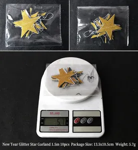 Macro view of golden glitter star banners in OPP packaging and weight measurement detail