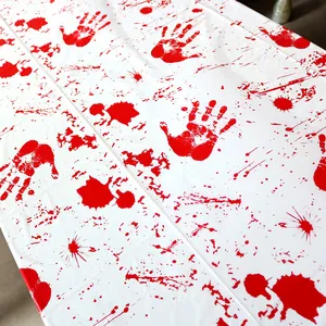 Detail view of bloody handprint pattern on white plastic Halloween party tablecloth