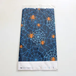 Detail of Halloween spider web pattern tablecloth in plastic retail packaging