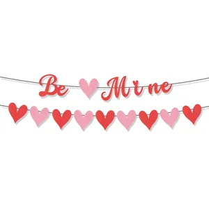 Glittering Be Mine heart banner set in red and pink for Valentine's Day party decoration