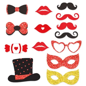 Detailed set of glittery party props including bows, lips, and masks for photo booths