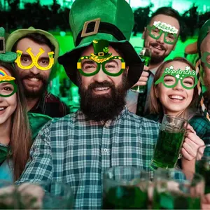 Green St. Patrick's Day shamrock and rainbow themed party glasses for festive photo props