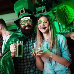 Detail of St. Patrick's Day party props showing festive glasses and green clover hat
