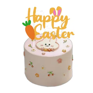Sparkly Happy Easter cake topper with rabbit ears on a pink frosted holiday cake