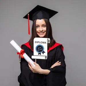 Close-up of graduation gown, cap with red tassel and diploma photo booth props set