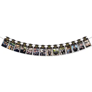 2026 graduation party photo banner with gold letters and black cap frames for display