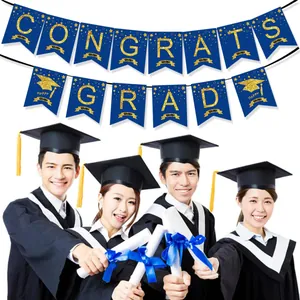 Detail of blue and gold Congrats Grad banner with glitter letters and graduation cap icon