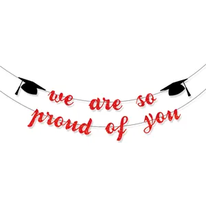 Glittery red Class of 2026 graduation banner with black doctoral caps for party decor