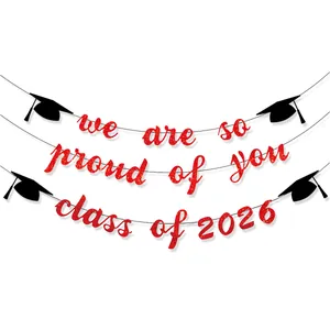 Red glitter Class of 2026 We are so proud of you banner with black doctoral caps decoration
