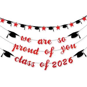 Red glitter Class of 2026 graduation banner with black doctor hats and stars decor
