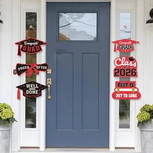 Detail of 2026 graduation party porch signs with red and black glitter Congrats Grad design