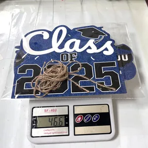 Weight measurement of 2025 graduation door sign showing 46.6g on a scale