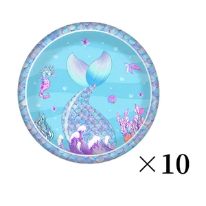 Detail of mermaid theme paper plates with scale pattern and sea creature designs