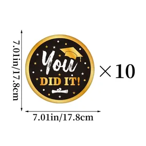 Detailed view of 7.01-inch black and gold graduation paper plates in a set of 10 pieces