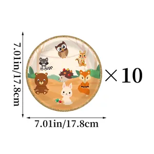 Close-up of 7-inch jungle animal paper plate with fox and bear patterns and gold rim