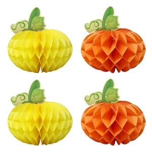 Detail of four 3D honeycomb paper pumpkins in orange and yellow for Thanksgiving