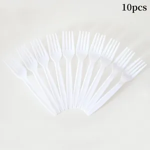 Set of 10 disposable white plastic forks arranged in a fan shape for pet party decor
