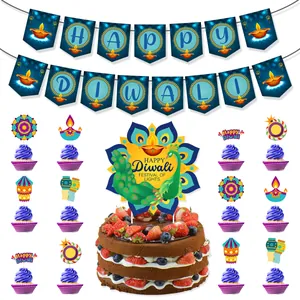 Detail of Happy Diwali banner and peacock cake toppers for Hindu festival party decor
