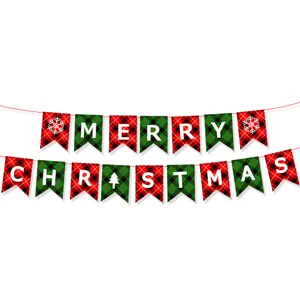 Detail of Merry Christmas bunting banners with red and green plaid patterns and snowflakes