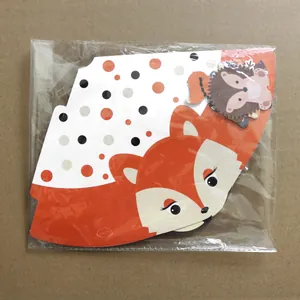 Flat-packed woodland animal party hats featuring fox and hedgehog patterns in plastic bag