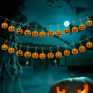 Halloween pumpkin banner with creepy Jack-o'-lantern faces on hanging twine decor