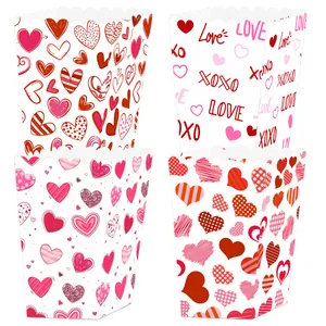 Close-up of four Valentine's Day popcorn boxes with heart patterns and Love text