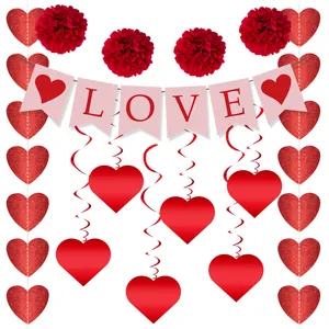 Detail of Valentine wedding decor set with LOVE banner red paper flowers and heart swirls