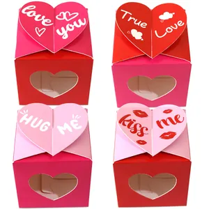 Detailed view of heart-shaped window gift boxes in red and pink with love text motifs