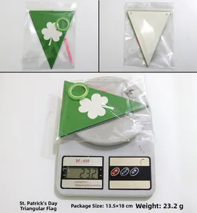 Package details of St. Patrick's Day green clover banners with ribbon and needle tools