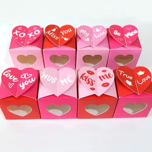 Close-up of heart-shaped candy boxes with romantic phrases and clear windows