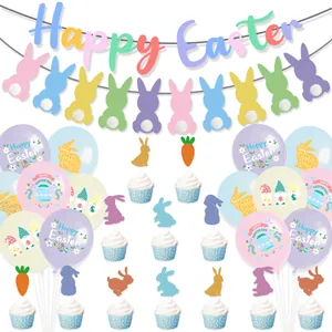 Detail of macaron Easter party set with Happy Easter banner, balloons and cake toppers