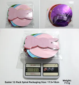 Detailed view of Easter spiral ornaments packaging and weight measurement on electronic scale