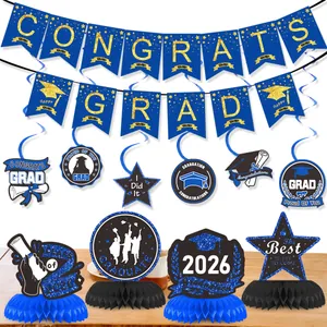 Detail of 2026 graduation party decor set with banners spirals and honeycomb table centerpieces