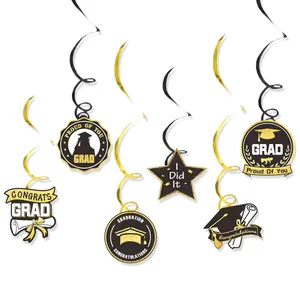 Detail of graduation swirl decorations with gold glitter caps, stars and congrats tags