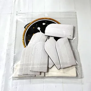 Detail of 2026 graduation party kit featuring black and gold banners in clear packaging
