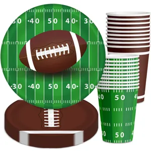 Detail of football party tableware set featuring grass turf and leather ball patterns