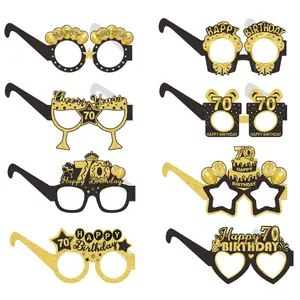 Set of 8 diverse black and gold 70th birthday party paper glasses with glittery textures