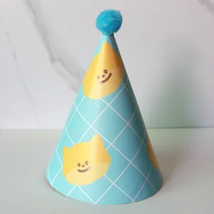 Detail of blue grid party hat with cute cartoon bear face and soft blue pompom topper