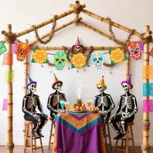 Close-up of colorful Day of the Dead sugar skulls and marigold banners for party decor