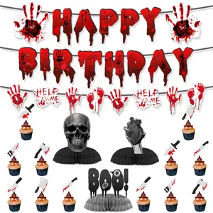 Macro view of bloody Halloween party decor including bloody handprints and cake toppers
