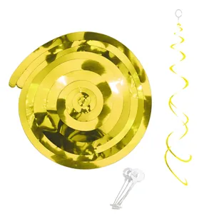 Close-up of golden hanging swirls decorations with metallic finish and plastic hooks