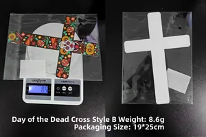 Day of the Dead floral cross decoration showing weight scale and OPP bag packaging
