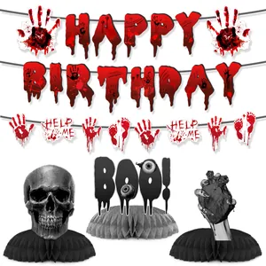 Macro view of Halloween bloody birthday banners and skull honeycomb table centerpieces