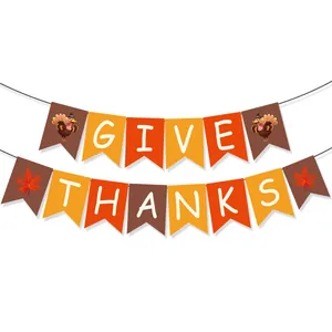 Detail of Give Thanks harvest banner with turkey and maple leaf prints for Thanksgiving